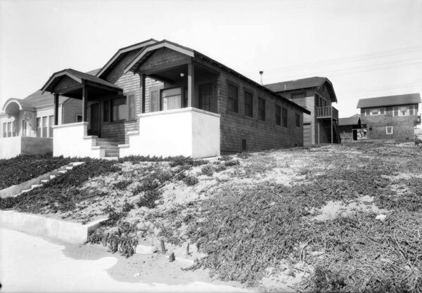 Manhattan Beach's original sand dunes are visible through the ice plants in this 1925 photo. Courtesy of the Dick Whittington Photography Collection, USC Libraries.
