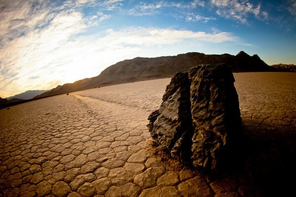 A rock and its trail behind it at Racetrack Playa in Death Valley National Park.