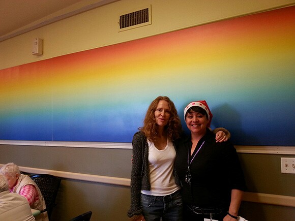 Artist Fawn Rogers with Activities Director Adriana Casanova in the common room at Alexandra Care Center, Hollywood.