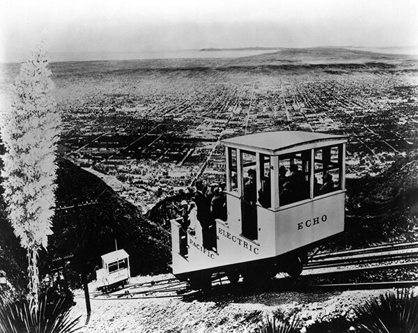 The Incline rail car "Echo" and another car named "Alpine" are both approaching the widened portion of the Incline Rail where they can pass, one ascending and the other descending. | Courtesy of the Los Angeles Public Library