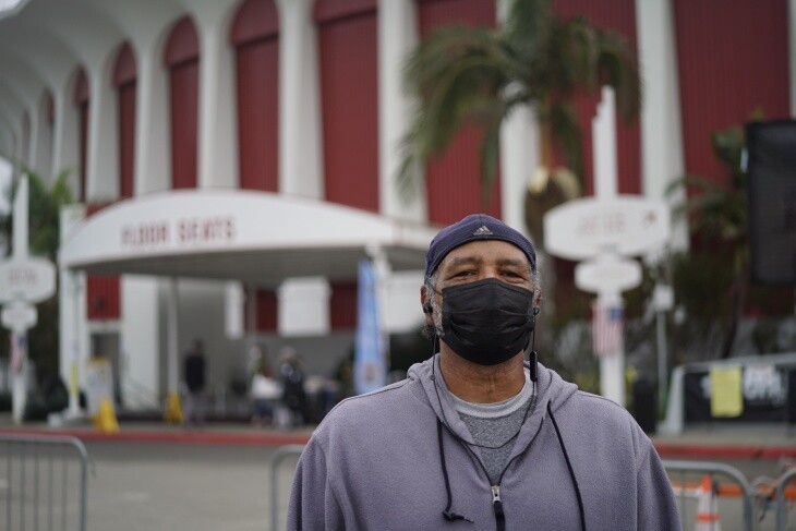 Lyle Nixon stands outside the Forum voting center in Inglewood. | Al Kamalizad for LAist