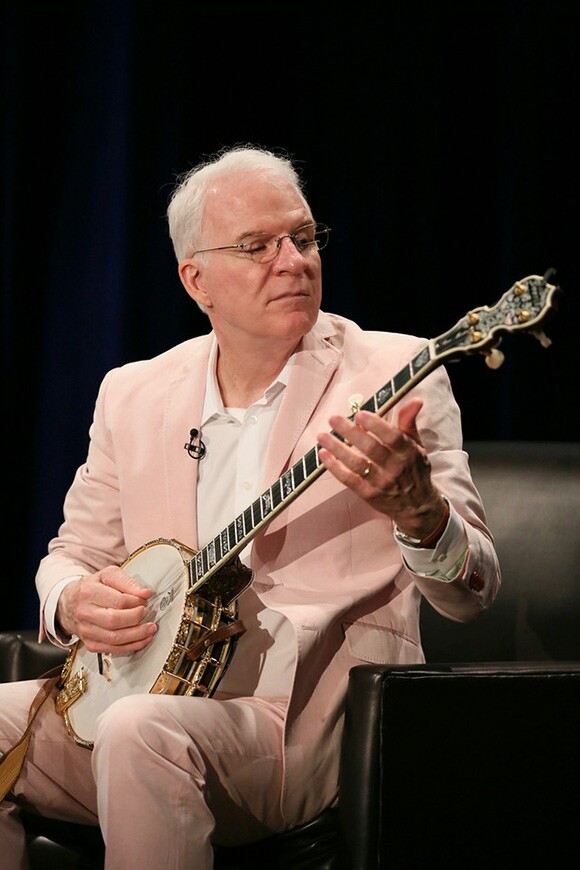 Steve Martin plays the banjo during The Un-Private Collection: Eric Fischl and Steve Martin, an art talk presented by The Broad museum and held at The Broad Stage on Monday, June 23, 2014, in Santa Monica, Calif. | Photo by Ryan Miller/The Broad