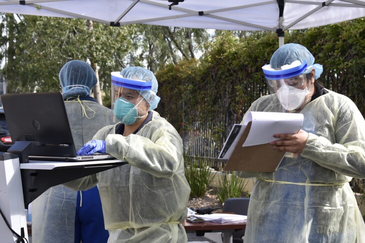 Health care workers are at AltaMed's Drive-thru COVID-19 testing in front of one of their clinics in East Los Angeles. | Courtesy of AltaMed Health Services