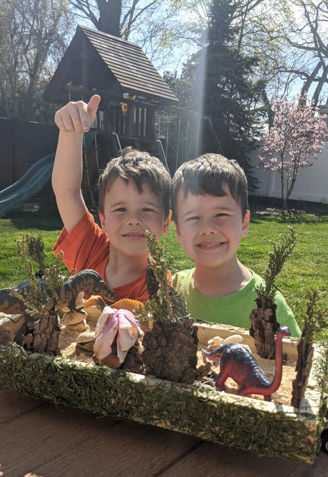 The Kerley children show off their dinosaur-themed float.