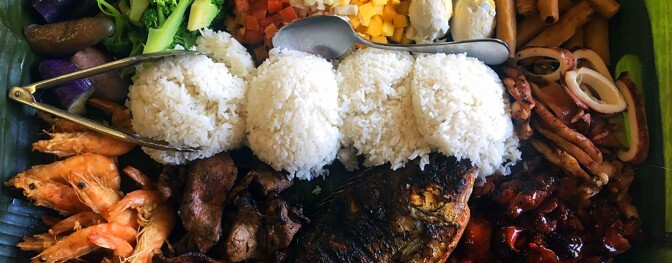 Kamayan dining with grilled fish, fried shrimp, eggplant, grilled squid and rice | Pampanguena Cuisine