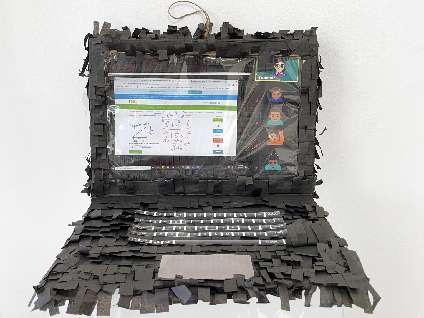 A piñata that looks like a laptop and a Zoom interface.