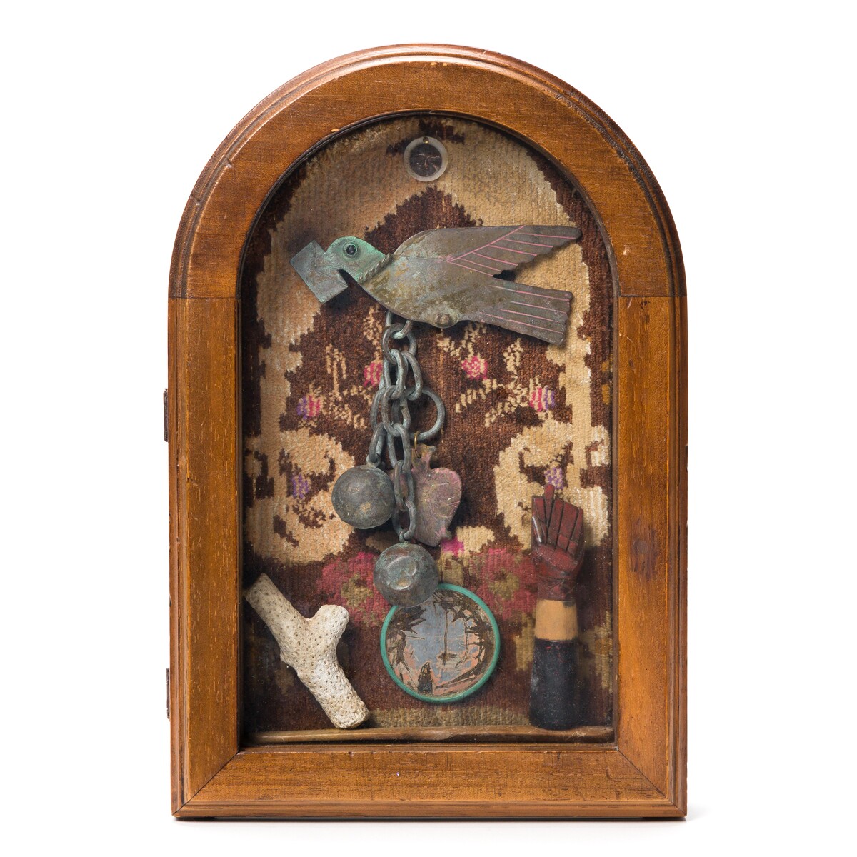 Betye Saar's piece "Sojourn" depicts a carrier bird being weighted down by a ball and chain and a heart.