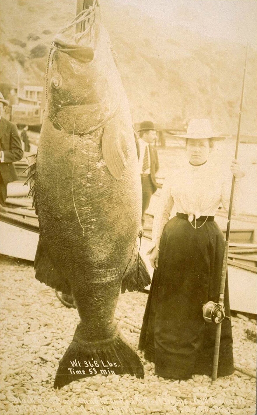 A tuna hanging out with a woman.