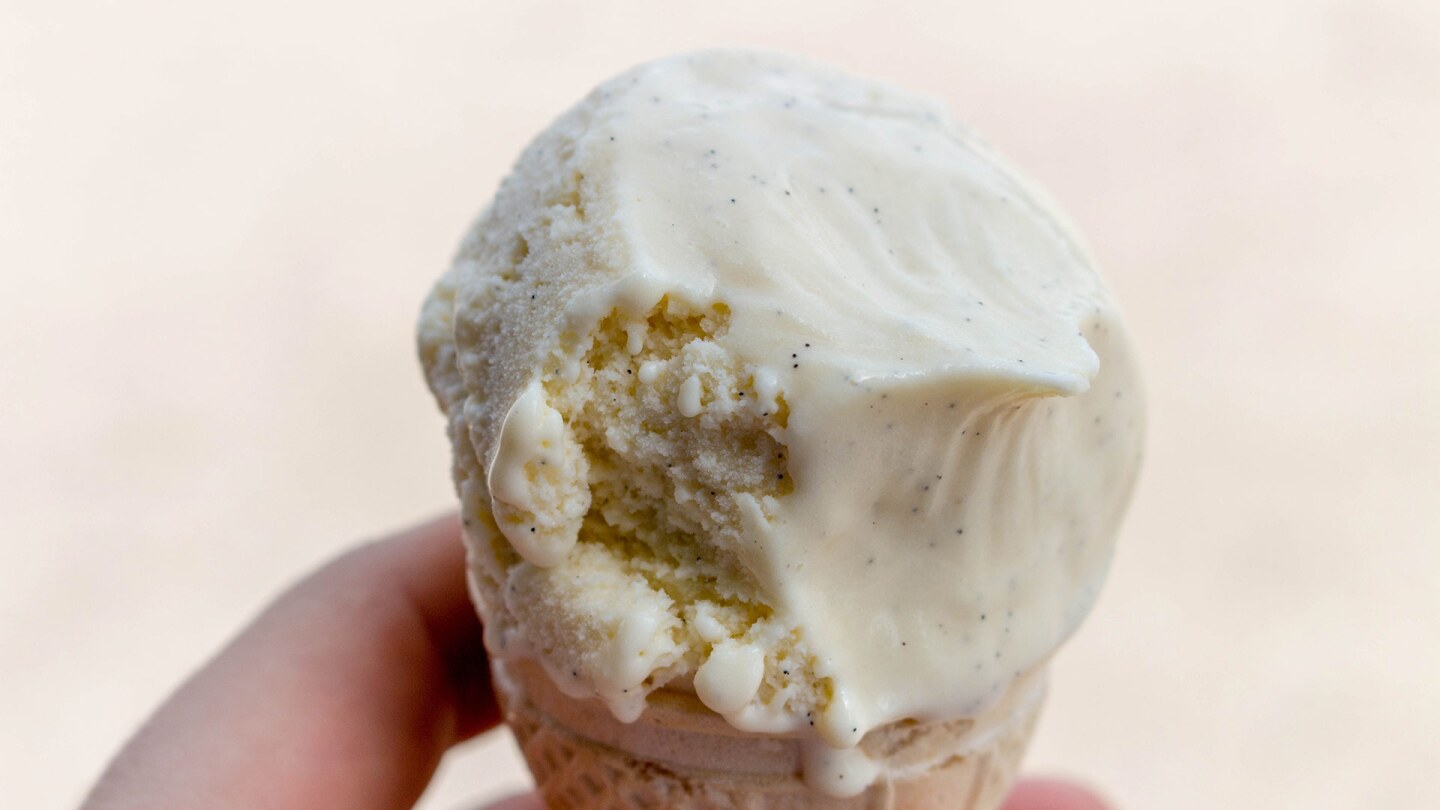 An ice cream scoop on top of a cone.