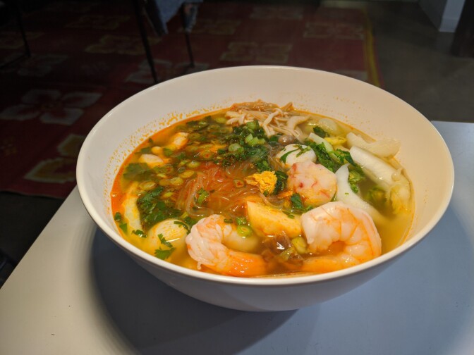 A bowl of sukiyaki, a mung bean noodle soup with shrimp.