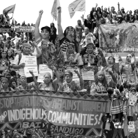 A collage on digital print on foamcore (8x8 feet, 12 x 8 feet, 16 x 8 feet, 12 x 8 feet) depicts women who helped organize around environmental concerns. It is a part of Carolina Caycedo's "Care Report."