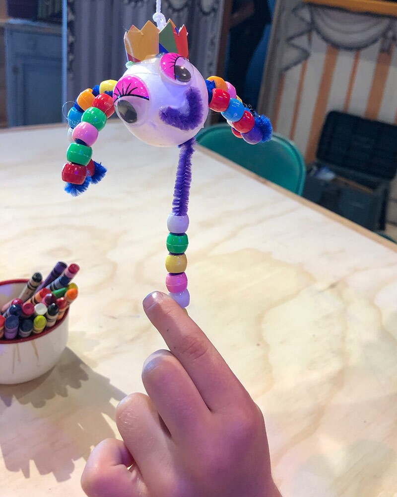 A child holds up a puppet made at the OxyArts and Kidspace Summer Camp in 2019. | Courtesy of Missy Steele
