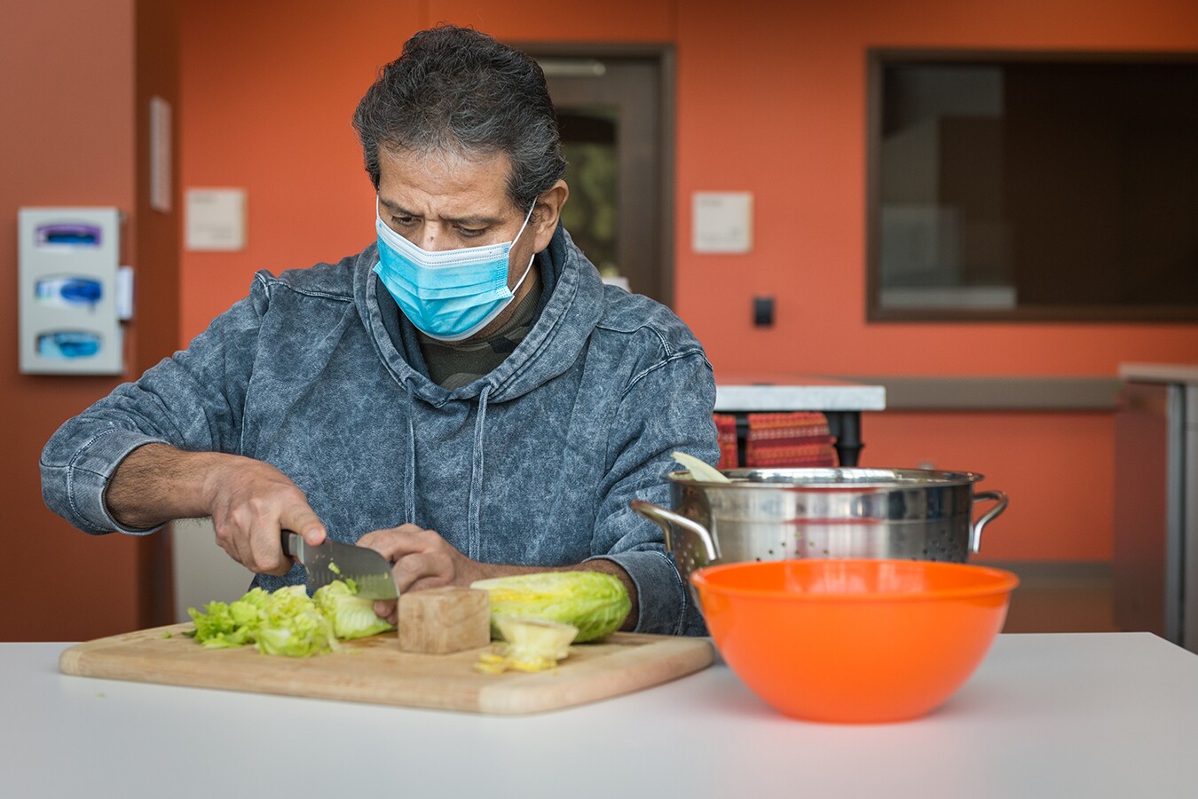 Perez was a cook at a hotel restaurant before he fell ill, so his occupational therapy involves meal preparation.