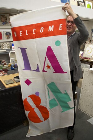 'I got it for 5 dollars at a garage sale' said Tanner Blackman as he unfurled his 1984 Olympic Banner | Photo: Ed Fuentes