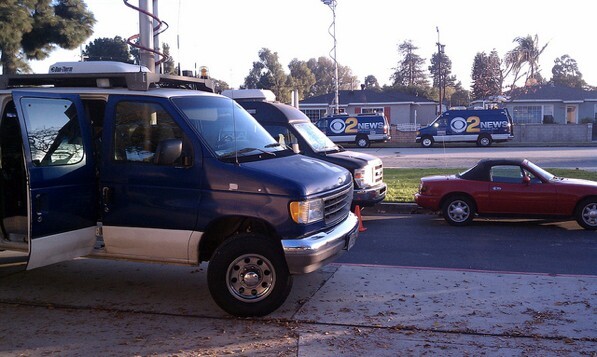 News vans gather at Gardena High School after this week's shooting.