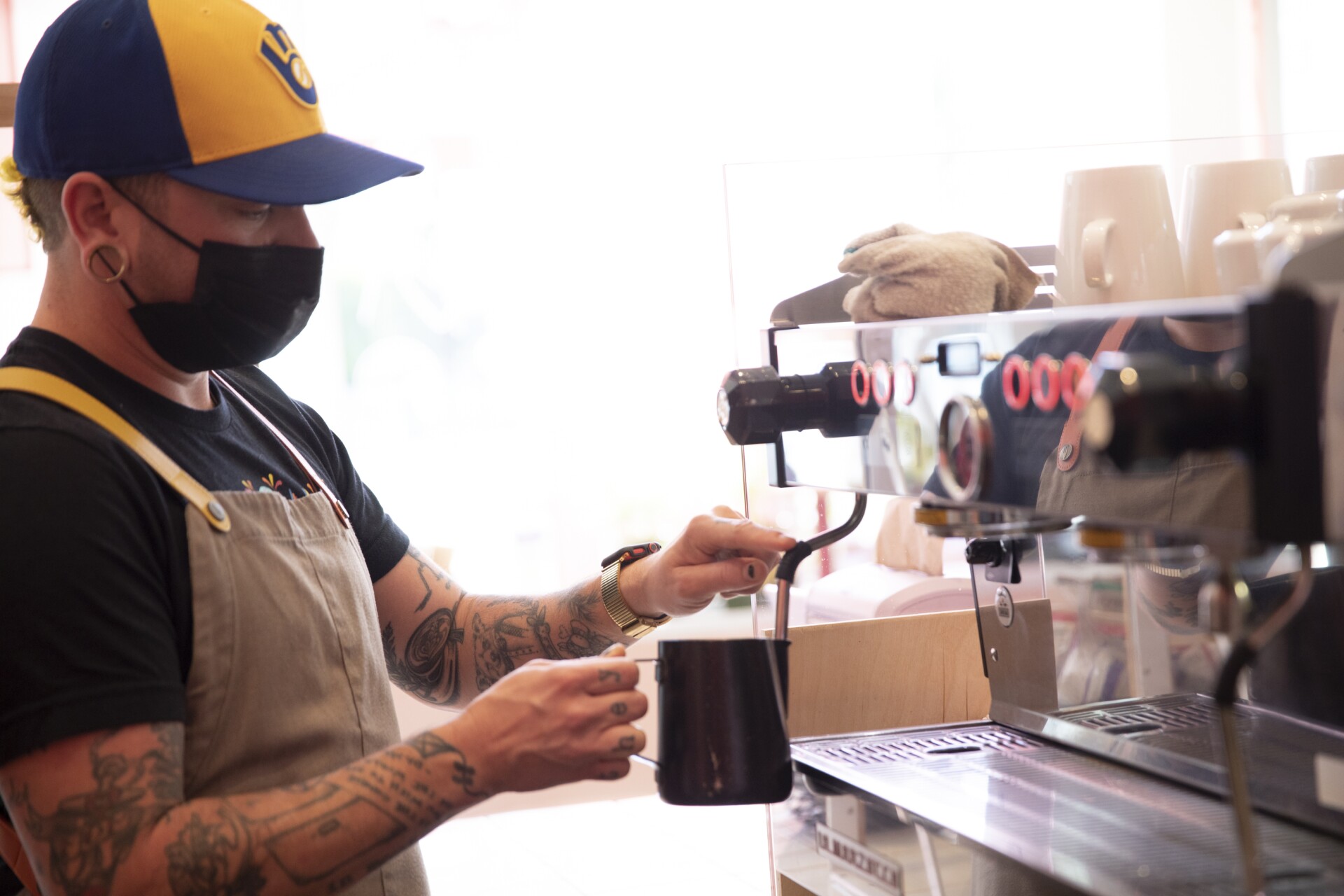 A barista making coffee.