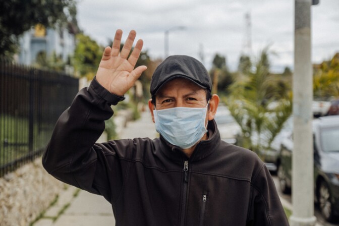 Vergilio Leon says face masks have changed everything for him. He finds it's difficult to convey his expressions, but when he has to greet someone he'll throw up his arm and loudly say hello. | Chava Sanchez/LAist
