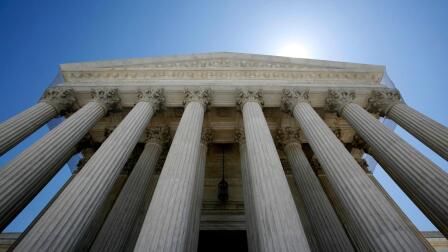 An upward shot of the Supreme Court building.
