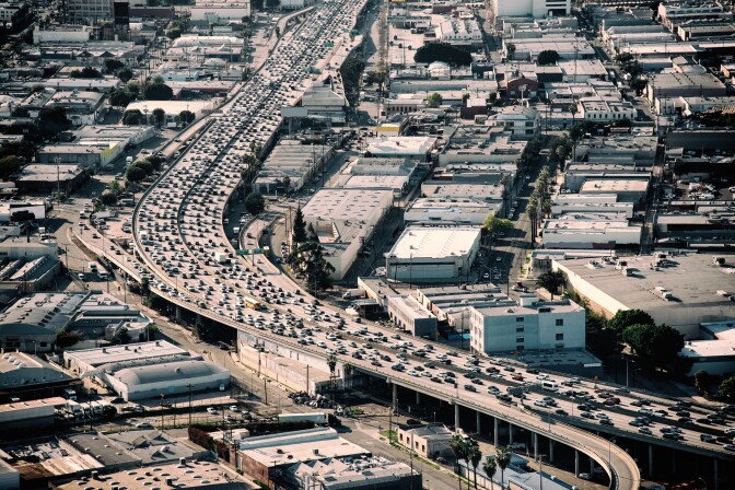 Heavy traffic during rush hour on Interstate 10 near downtown Los Angeles California during late afternoon.