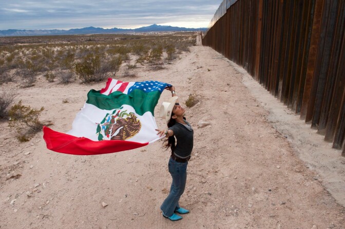 Raechel running at the border fence near Agua Prieta by Stefan Falke