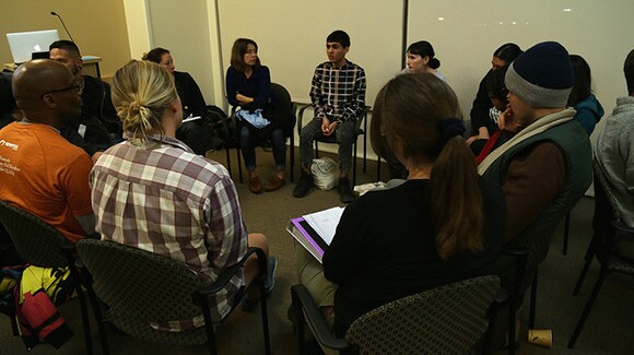 Individuals in dialogue between presentations during Flowers For Action, Seeds For Change event at CalState University Los Angeles, part of Chats About Change event 1/15/15. | Photo: Emily Lacy.