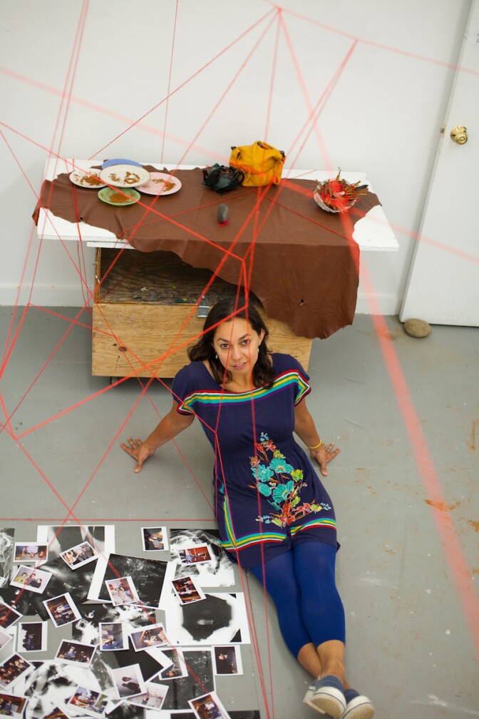 Photographer Mercedes Dorame poses in front of her "Coordinates" installation.