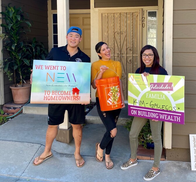 homebuyers outside a home