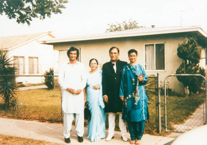 Syed and Qaiser with their children Qamar and Faozia in front of a home in Los Angeles. | Shades of L.A. Collection / LAPL