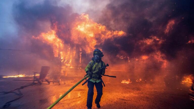 Communities struggle with rebuilding a year after LA fires