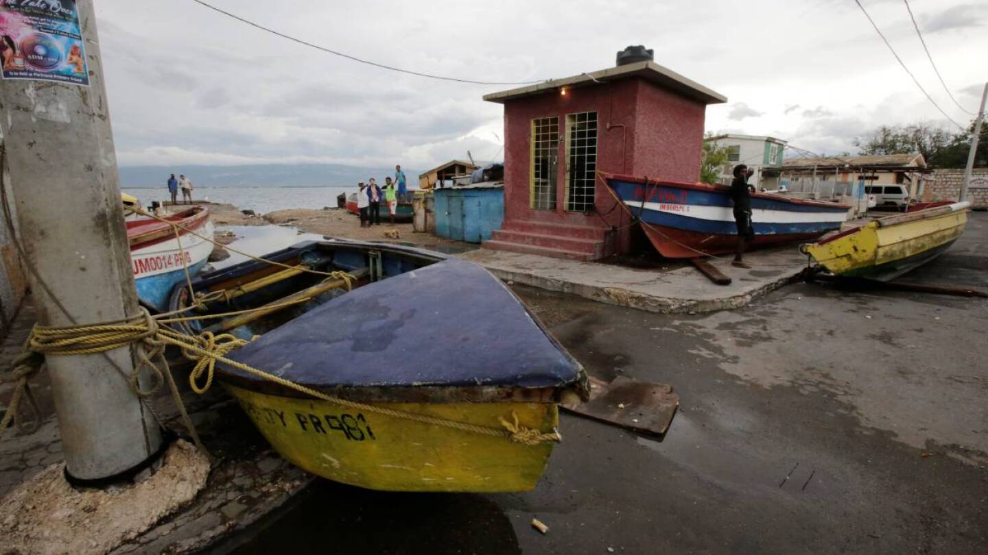 ARCHIVE PHOTO: Boats are secured off as residents look on at Port Royal while Hurricane Matthew approaches in Kingston, Jamaica October 2, 2016. | REUTERS/Henry Romero