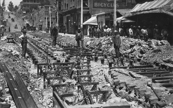 Workers dig up abandoned cable car railway tracks on Second Street. Courtesy of the Metro Transportation Library and Archive.