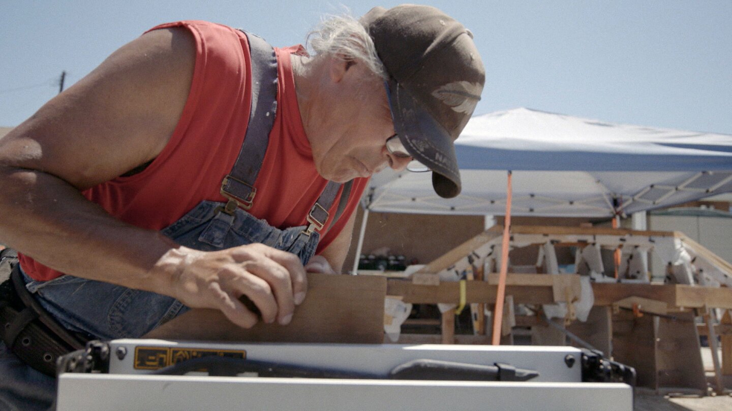 Member of Ti'at Society saws wood during the making of the traditional boat. | Still from "Tending Nature" episode "Rethinking The Coast with the Ti'at Society"