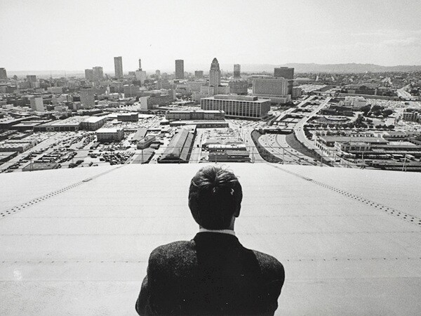 Delmar Watson (back to camera) looks out over downtown Los Angeles. Courtesy of the Watson Family Photographic Archive.