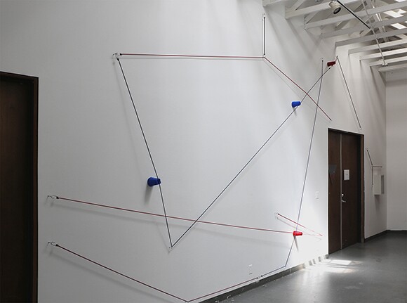 "Picnic," 2014. Bungee cords, plastic cups, and hardware. Installed dimensions variable. "Priority Required," installation at 18th Street Arts Center Atrium Gallery, 2014. | Courtesy 18th Street Arts Center