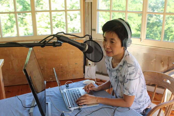 Reina Higashitani working on her podcast series during an artist residency in upstate New York | Courtesy of Reina Higashitani