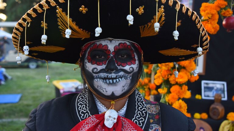 Costumed Calaca Sugar Skull attendees at the Hollywood Forever's Dia De Los Muertos celebration at Hollywood Forever on October 28, 2017 in Hollywood, California. (Photo by Araya Diaz/Getty Images)