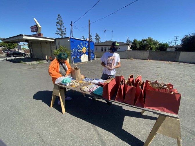 Jake Freilich, Ducle Soledad Ibarra and Ana Briz prepare the art supply kits for high schoolers | Courtesy of Crenshaw Dairy Mart