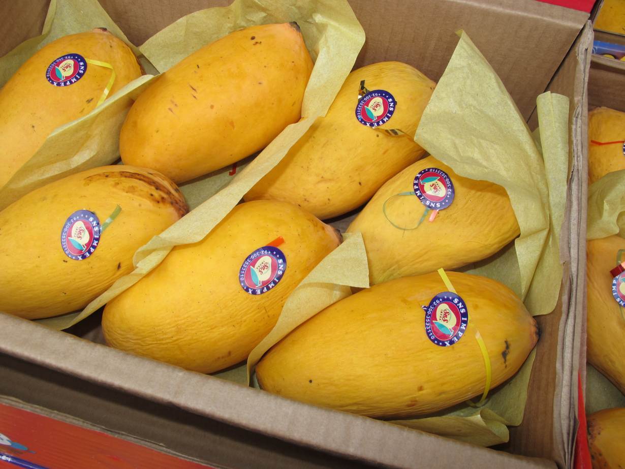 A box of honey mangoes grown in Pakistan on display for sale in the Tooting neighborhood of London, June 15, 2020. | Thomson Reuters Foundation/Laurie Goering
