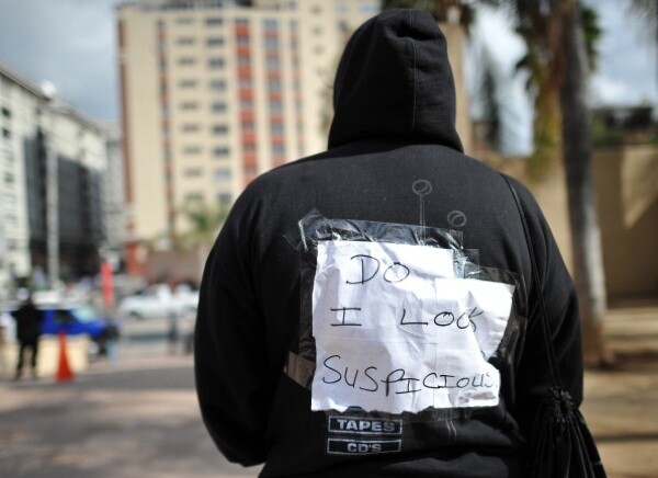 A woman joins nationwide protests in memory of slain Florida teenager Trayvon Martin on March 26, 2012 in downtown of Los Angeles | Photo: JOE KLAMAR/AFP/Getty Images
