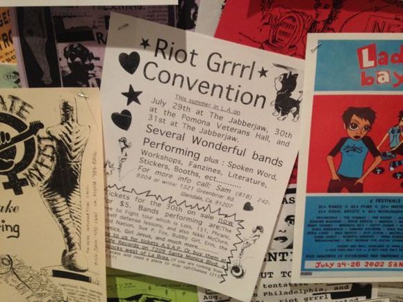Flyers on display in "Alien She." | Photo: Liz Ohanesian