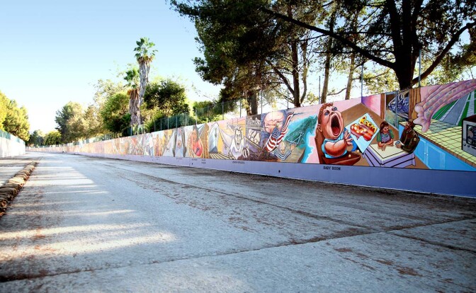 A view of the 13’ x 2,400’ “Great Wall” mural located in the Tujunga Wash, a flood control channel. It depicts a multi-cultural history of California from prehistory through to the 1950s.