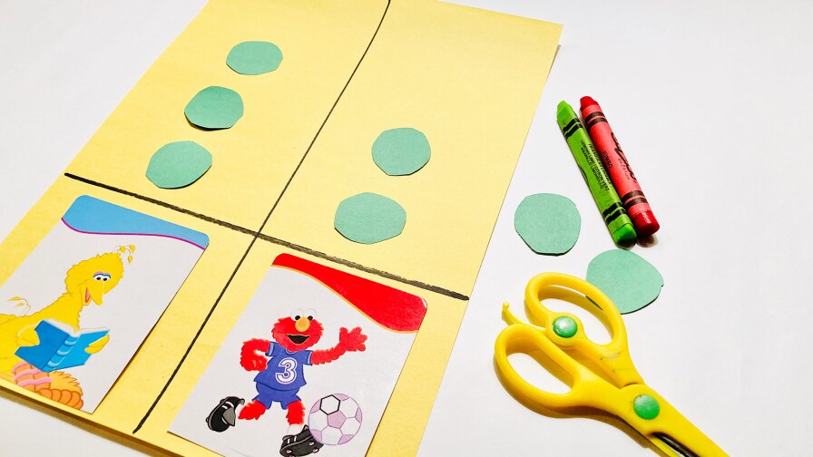 A sheet of construction paper used to count out votes with the options as Big Bird or Elmo