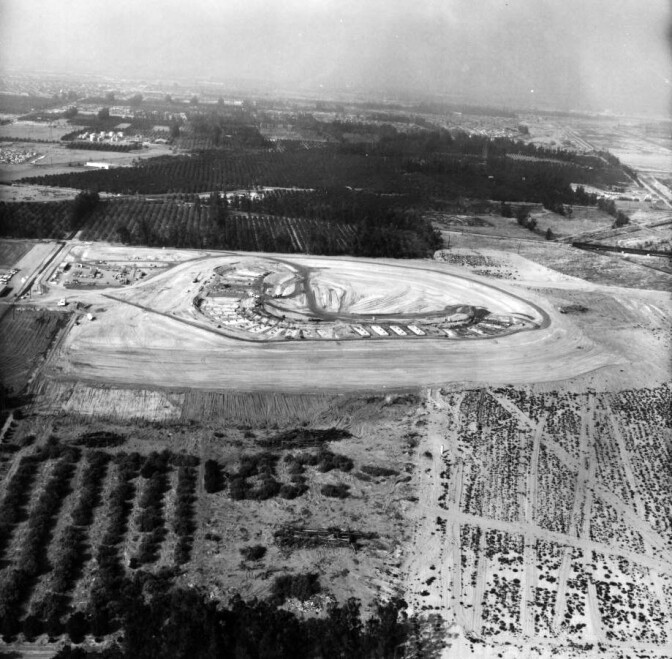 Anaheim Stadium and the surrounding parking rose from formerly agricultural land once devoted to growing corn, alfalfa, and oranges. Here, bulldozers clear the site for construction.