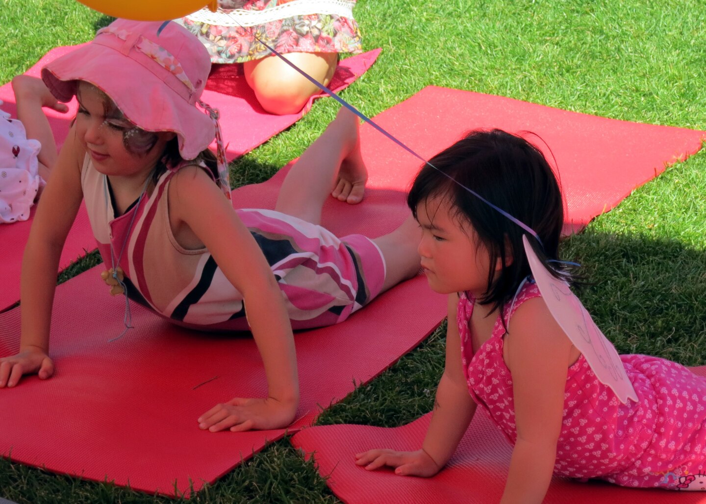 Children following yoga poses