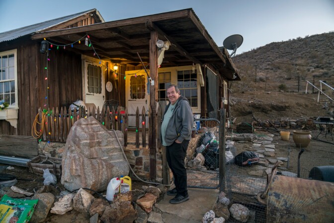 Retired miner Tom O’Donnell, a.k.a. “Ordinary Tom” in front of his historic home in Randsburg, California. | Kim Stringfellow.