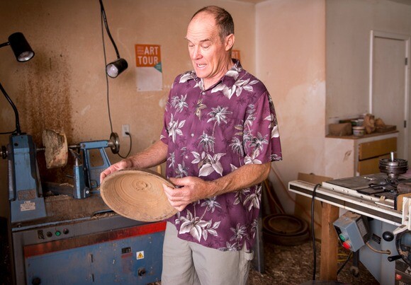Barry Lundgren holds a rough-turned wooden bowl. | Photo: Chris Daly.