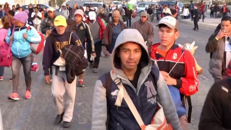 Still from footage of coverage of the migrant caravan. | Still from "Democracy Now"