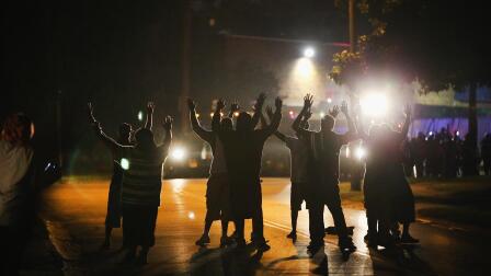 Family of slain Mo. teen call for calm after violent protest
