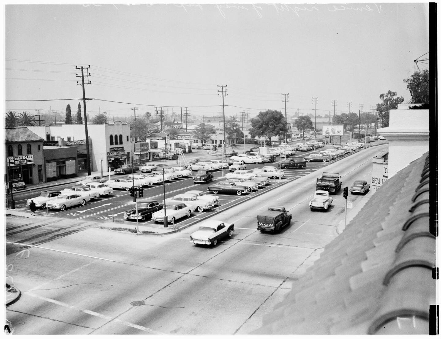 In 1955, a Culver City auto dealership used the abandoned median of Venice Boulevard as a storage lot. Courtesy of the USC Libraries - Los Angeles Examiner Collection.