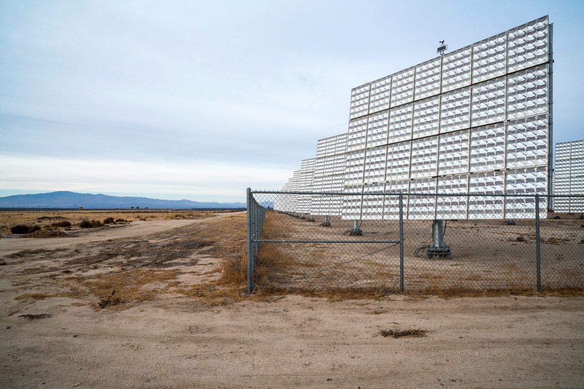 A solar array with others in the distance sited due west of the Del Sur Elementary School at 90th Street West and Avenue H in Lancaster, CA. | Kim Stringfellow © 2017